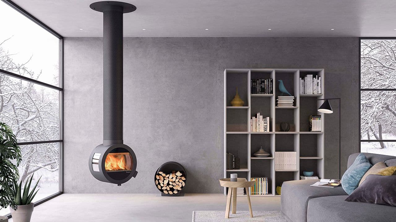 Rund peis festet til tak i minimalistisk stue.